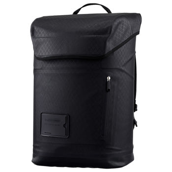 Minimalist daypack with a magnetic lid opening that can be securely locked for added content protection